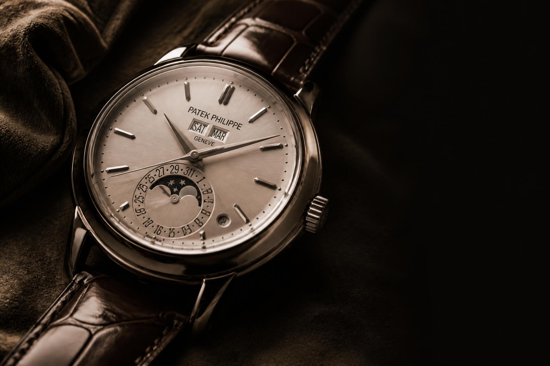 Swiss mechanical wristwatch photographed in warm low light